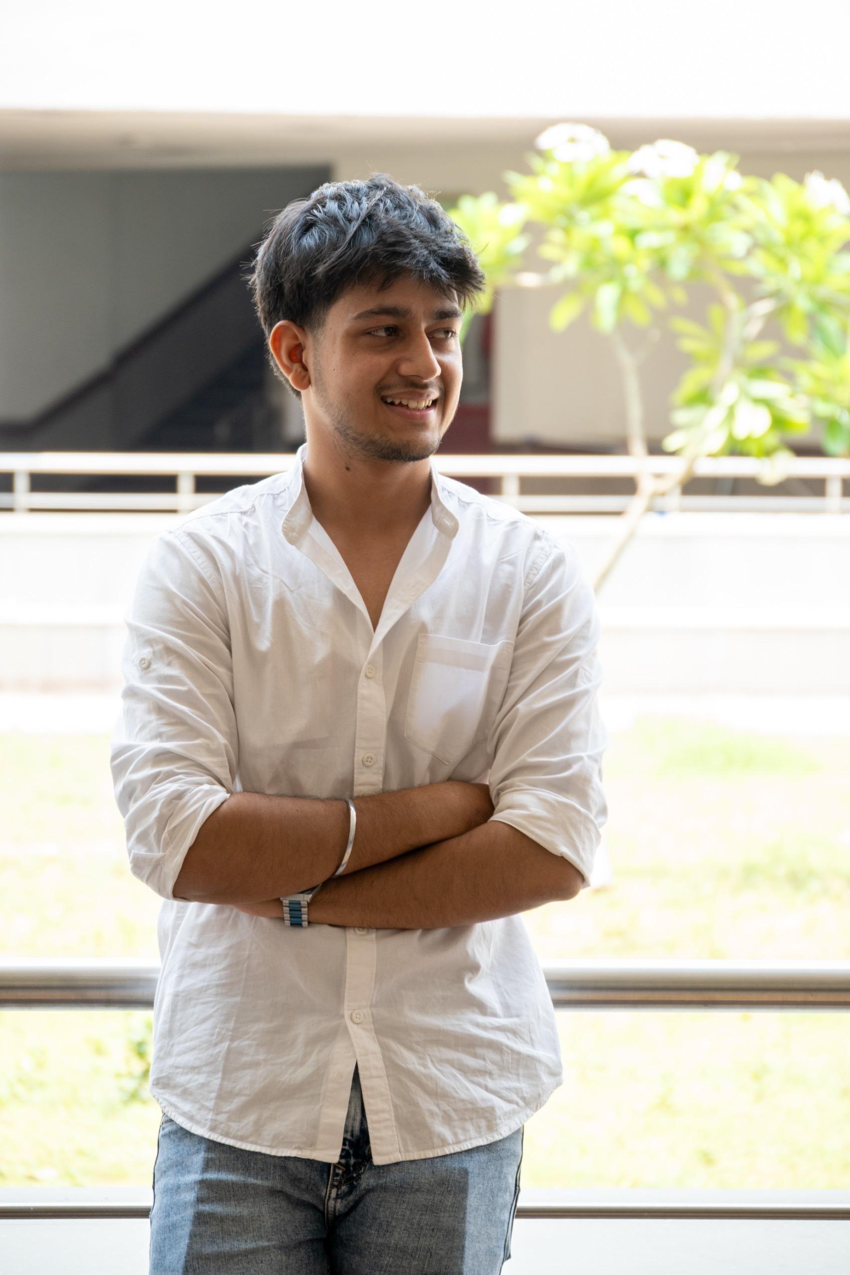 Ayush Sharma, founder of Victorus, smiling with arms crossed